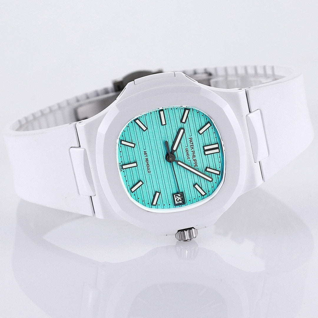 Patek Philippe watch, turquoise dial, white rubber strap, wide side view with visible bezel