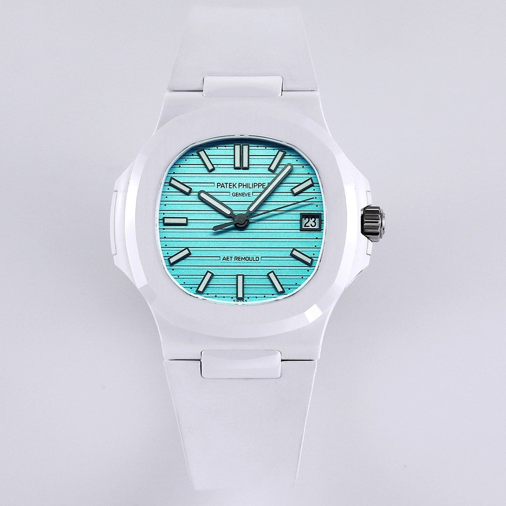Patek Philippe watch, turquoise dial, white rubber strap, round bezel, baton hour markers