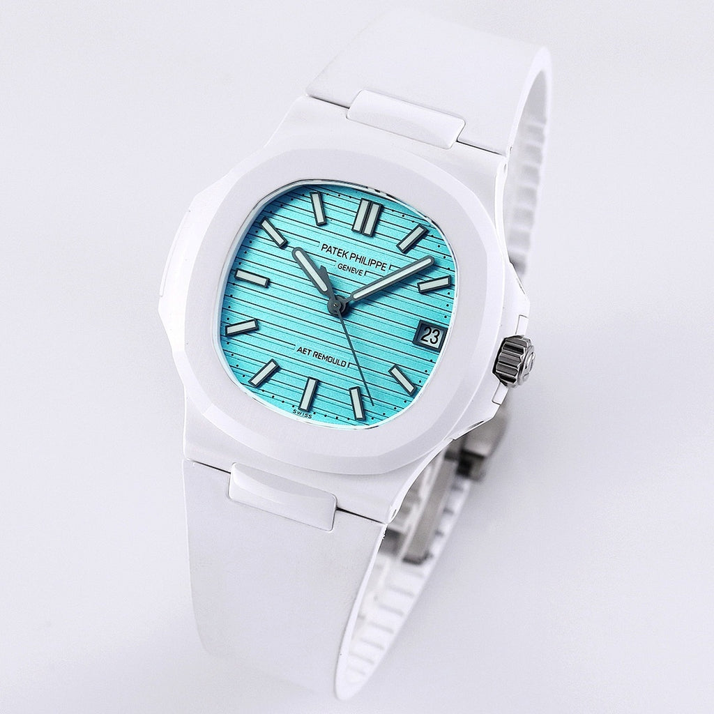 Patek Philippe watch, turquoise dial, white rubber strap, angled front view, baton hour markers