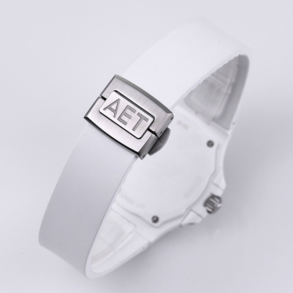 White rubber wristwatch strap clasp with metal buckle and embossed buckle detail