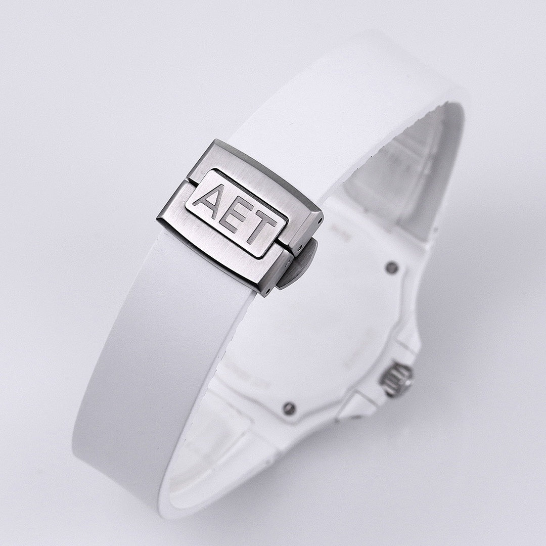 White rubber wristwatch strap clasp with metal buckle and embossed buckle detail