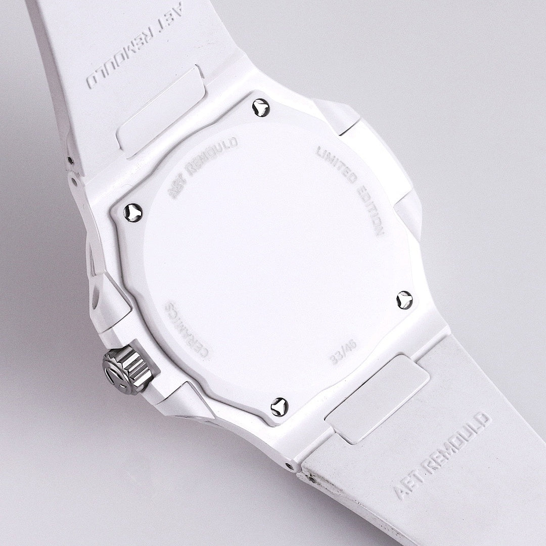 White rubber watch case with metal bezel and visible caseback screws on side