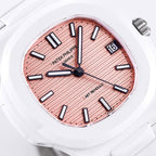 White rubber wristwatch face close-up: rose dial, black hour bars, date window at 3