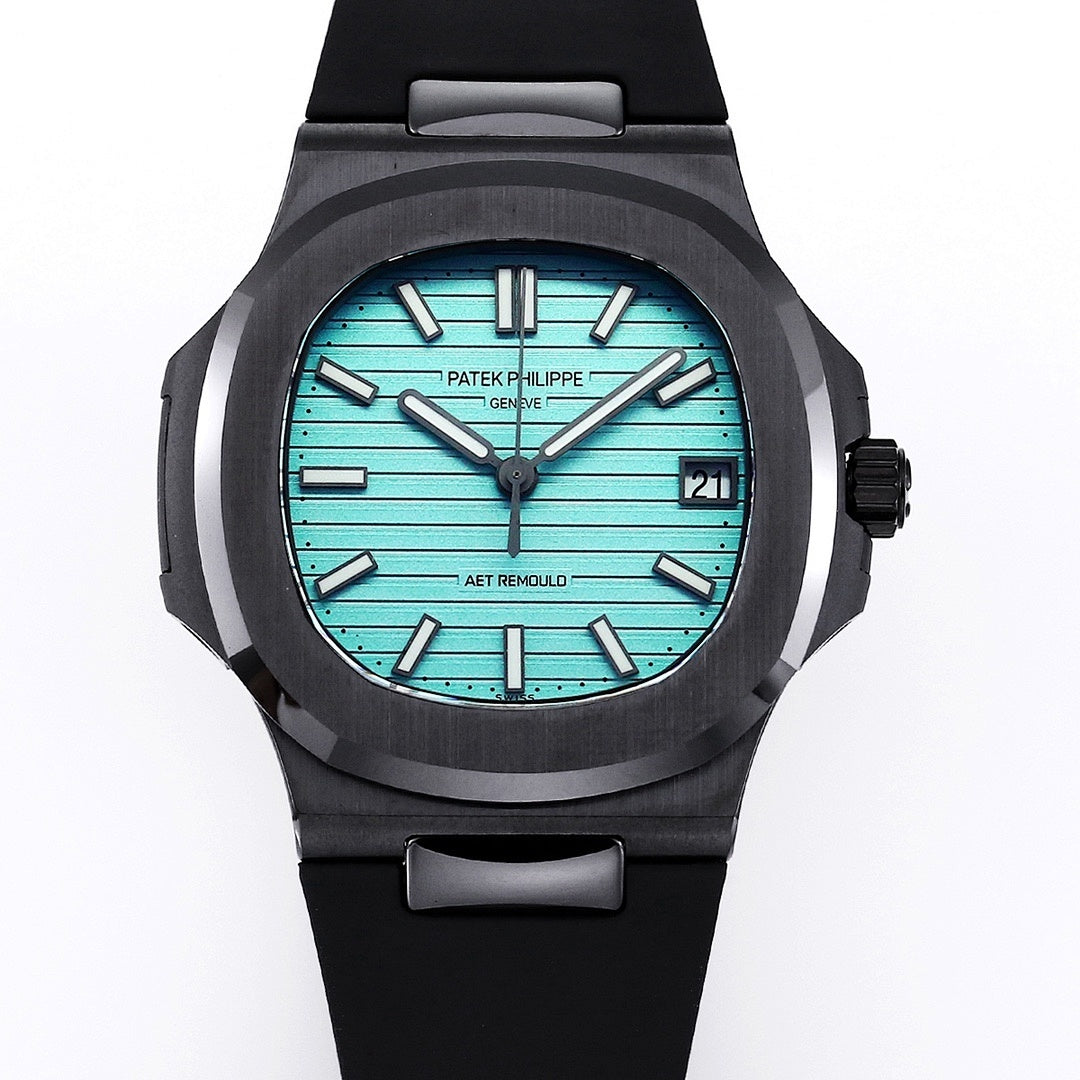 Patek Philippe watch front view, turquoise dial with date window, black rubber strap.