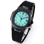 Patek Philippe watch angled side view, turquoise dial, black rubber strap and bezel.