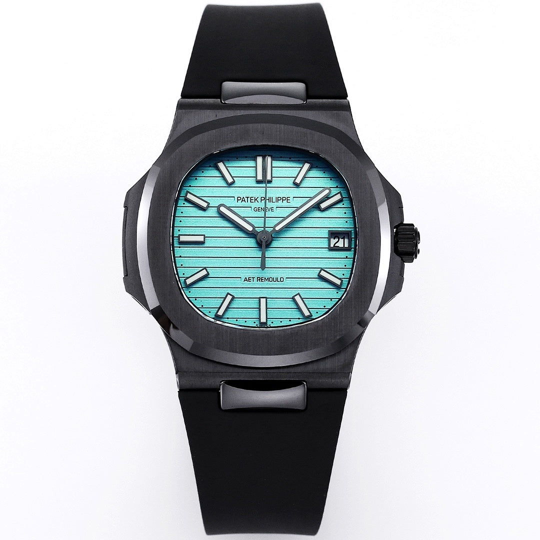 Patek Philippe watch with turquoise dial, black rubber strap, date display at 21.