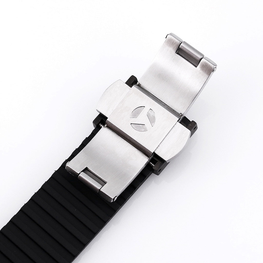 Patek Philippe watch with silver-toned clasp and black rubber strap