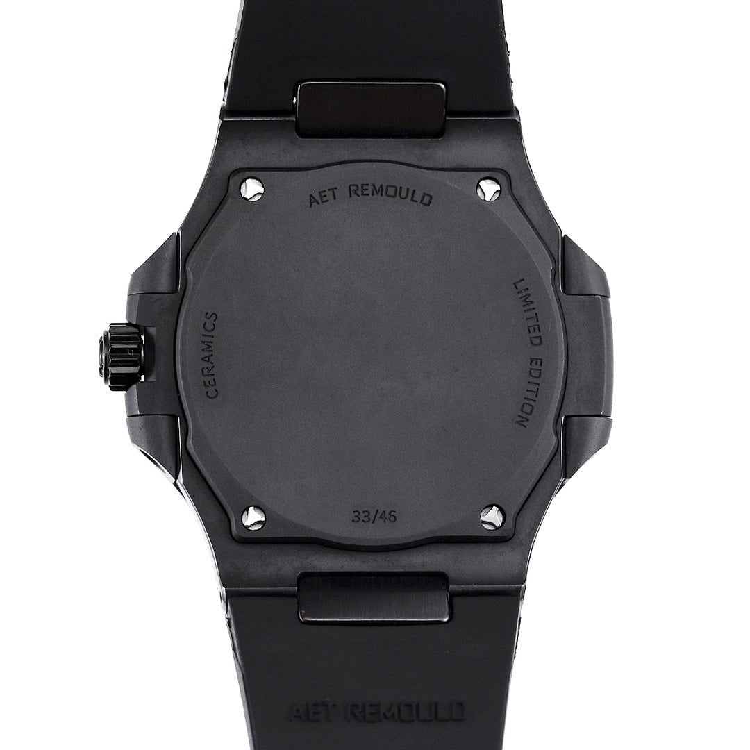 Black watch caseback with AET REMOULD marking and screws, black rubber strap
