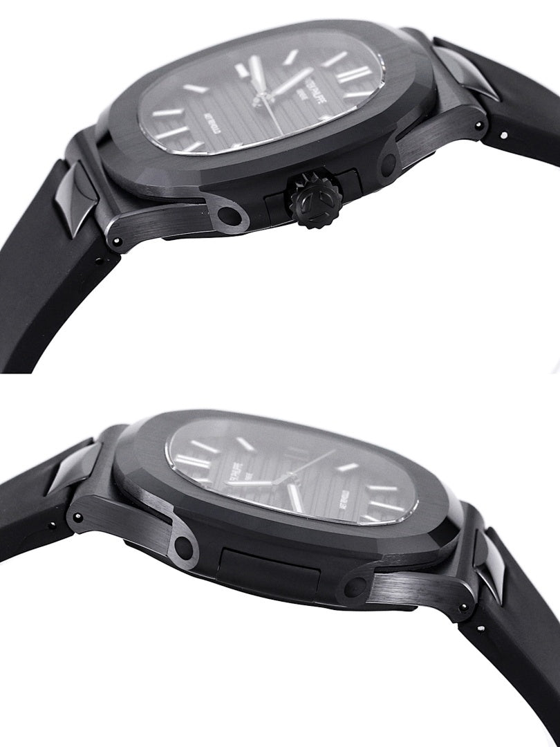 Black sports watch with sculpted case and black rubber strap, side profile