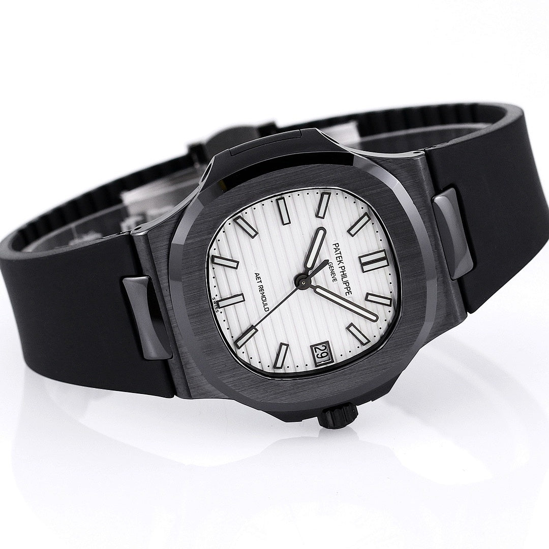 Black rubber wristwatch with white dial and date window, viewed at an angle.