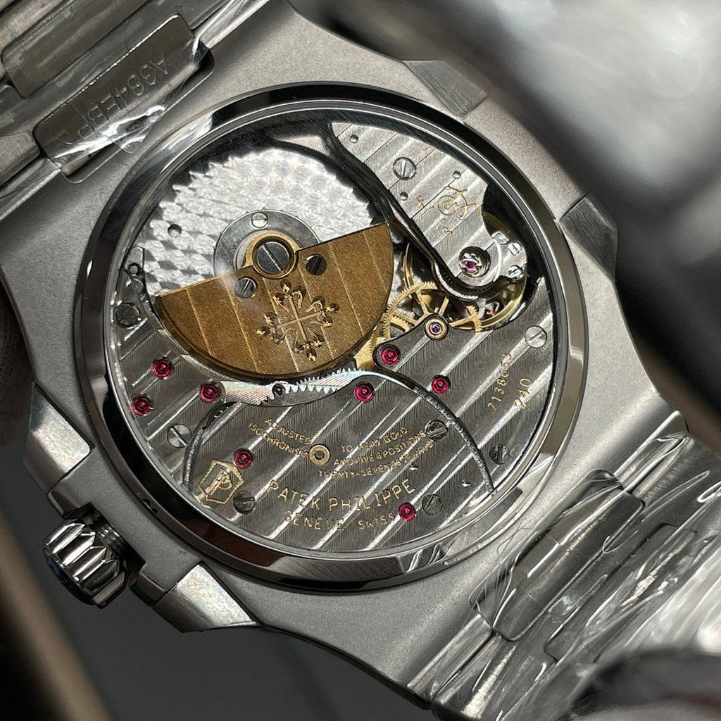 Stainless steel wristwatch caseback showing detailed mechanical movement components