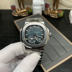 Stainless steel wristwatch with dark dial, teal accents, and linked metal bracelet