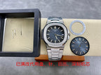 Patek Philippe wristwatch with dark blue dial and steel bracelet, shown with extra dial