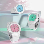 White sport watches with light blue, green, and pink dials on silicone straps