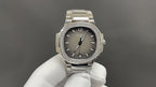 Patek Philippe watch with gray dial, diamond bezel, and stainless steel bracelet