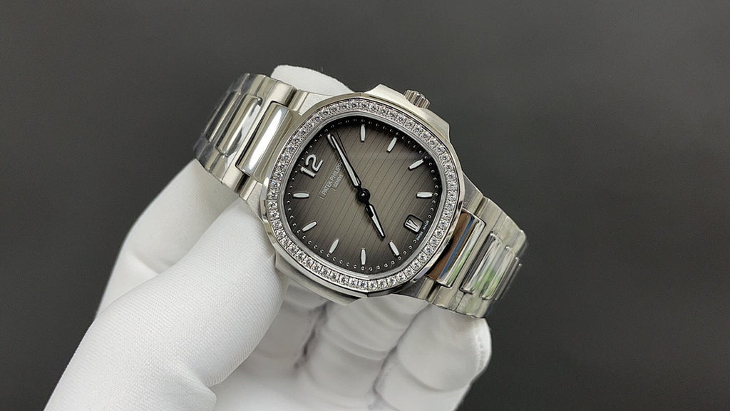Patek Philippe watch, dark gray dial, diamond bezel, and stainless steel bracelet links