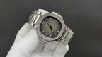 Patek Philippe watch, dark gray dial, diamond bezel, and stainless steel bracelet links