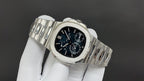 Stainless steel wristwatch angled view with black dial and linked metal bracelet.