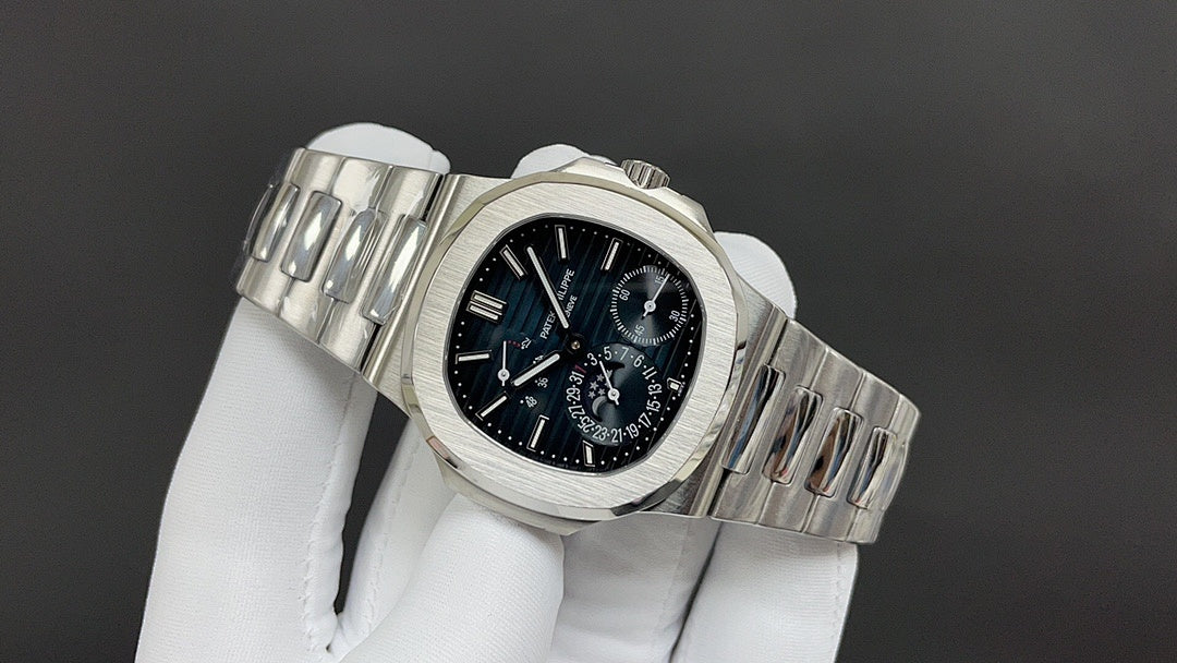 Stainless steel wristwatch angled view with black dial and linked metal bracelet.