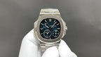 Stainless steel wristwatch with black dial, slim bezel, and metal bracelet with clasp.