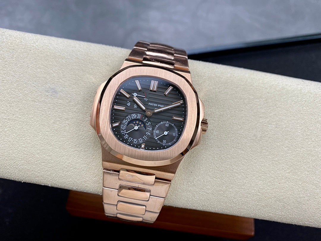 Rose gold-tone wristwatch with blue dial and metal bracelet, three-quarter view.