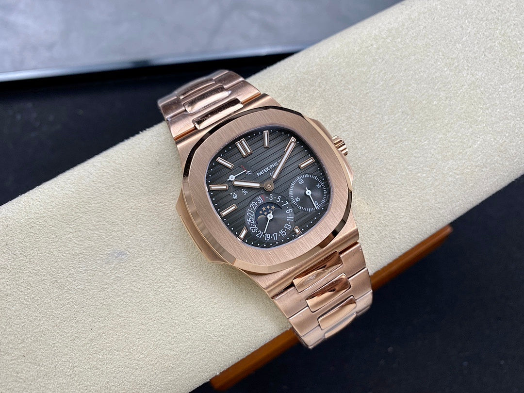 Rose gold-tone wristwatch with blue dial and metal bracelet, top angled view.