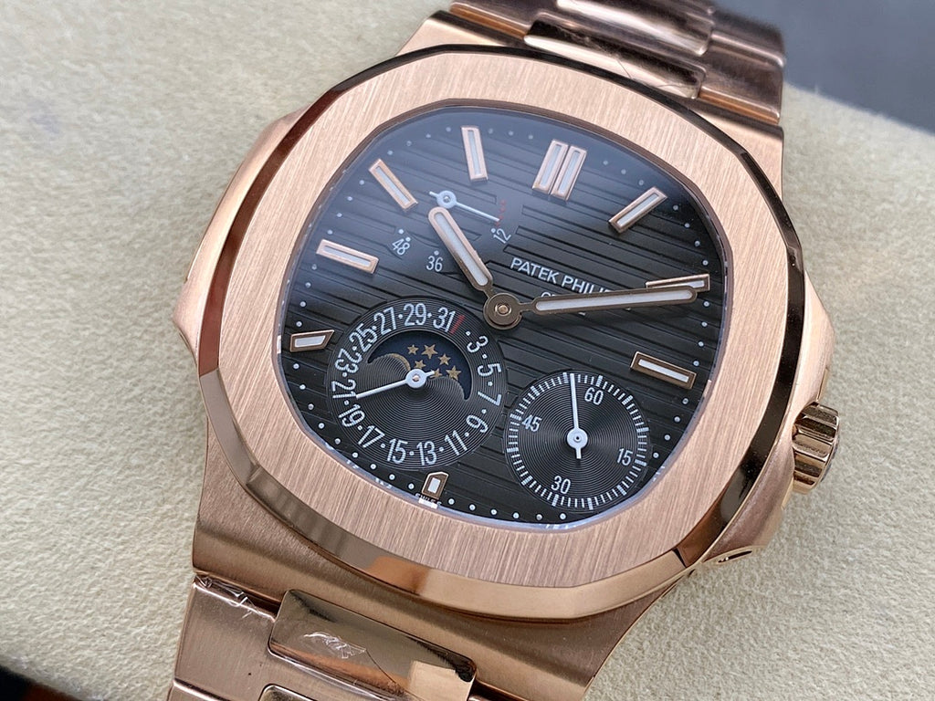 Rose gold-tone wristwatch with blue dial and metal bracelet, front close-up.