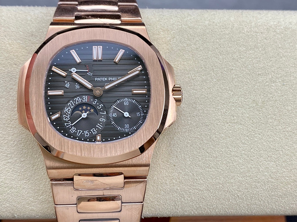 Rose gold-tone wristwatch with blue dial and metal bracelet, front view.