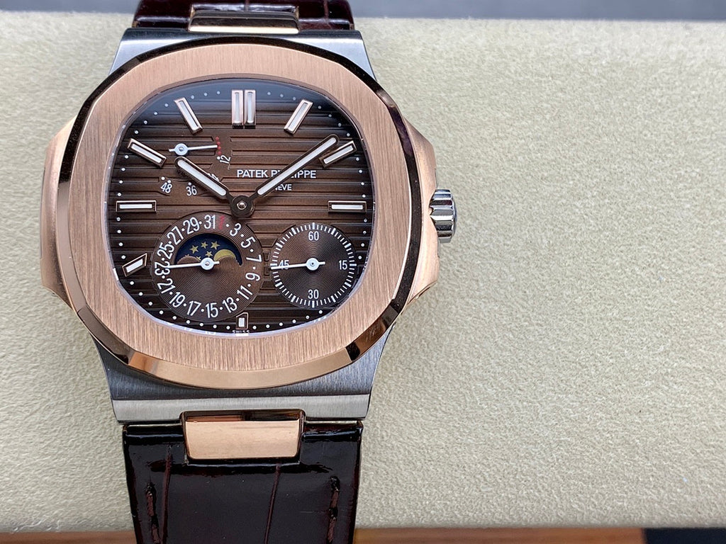 Patek Philippe watch front view with black dial, rose-gold case, and dark leather strap