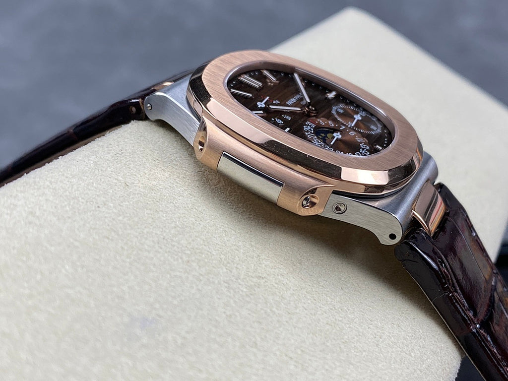Patek Philippe watch angled view with dark dial, rose-gold case, and dark leather strap