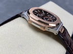 Patek Philippe watch angled view with dark dial, rose-gold case, and dark leather strap
