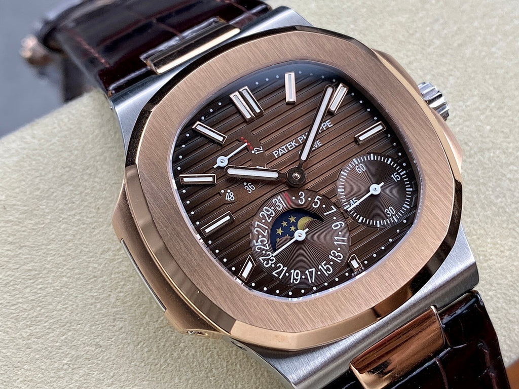 Patek Philippe watch close-up with rose-gold case, black dial details, and dark leather strap