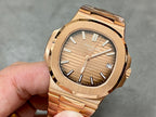 Gold-tone Patek Philippe wristwatch with textured dial and metal bracelet.