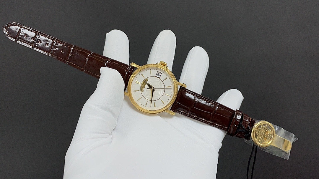 Patek Philippe wristwatch on brown leather strap with gold-tone buckle and case