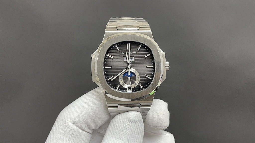 Stainless steel Patek Philippe watch, black dial with blue ring detail