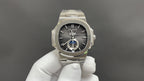 Stainless steel Patek Philippe watch, black dial with blue ring detail