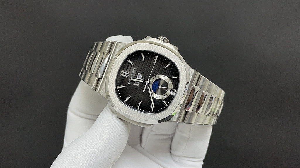 Stainless steel Patek Philippe watch angled, black dial with blue accents