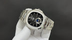 Stainless steel Patek Philippe watch angled, black dial with blue accents
