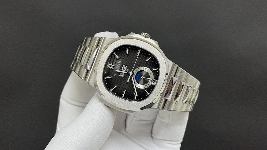 Stainless steel Patek Philippe watch angled, black dial with blue accents