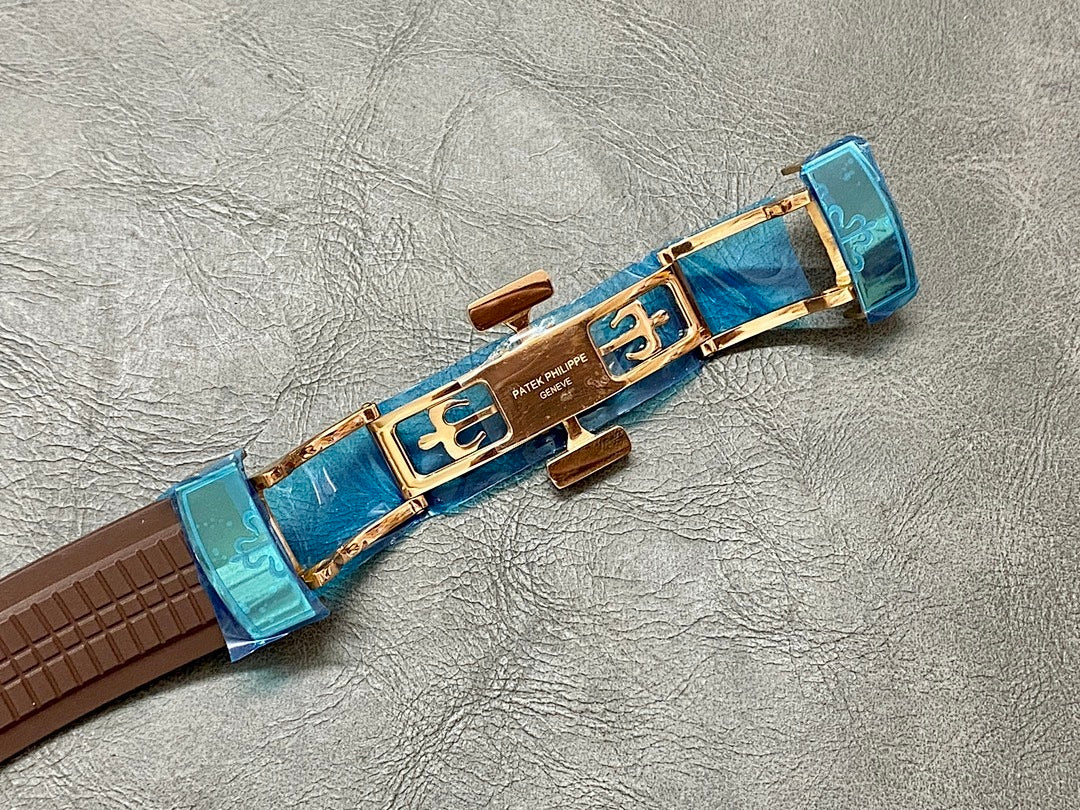 Brown leather watch strap with blue clasp and gold-toned clasp hardware