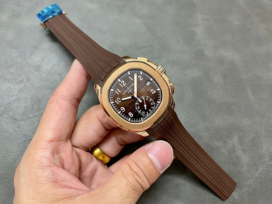 Patek Philippe wristwatch with brown leather strap, gold-toned case, dark dial