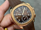 Patek Philippe wristwatch close-up with brown leather strap, gold-toned case, dark dial
