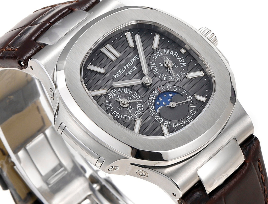 Patek Philippe Nautilus watch dial close-up with moonphase subdials and black face
