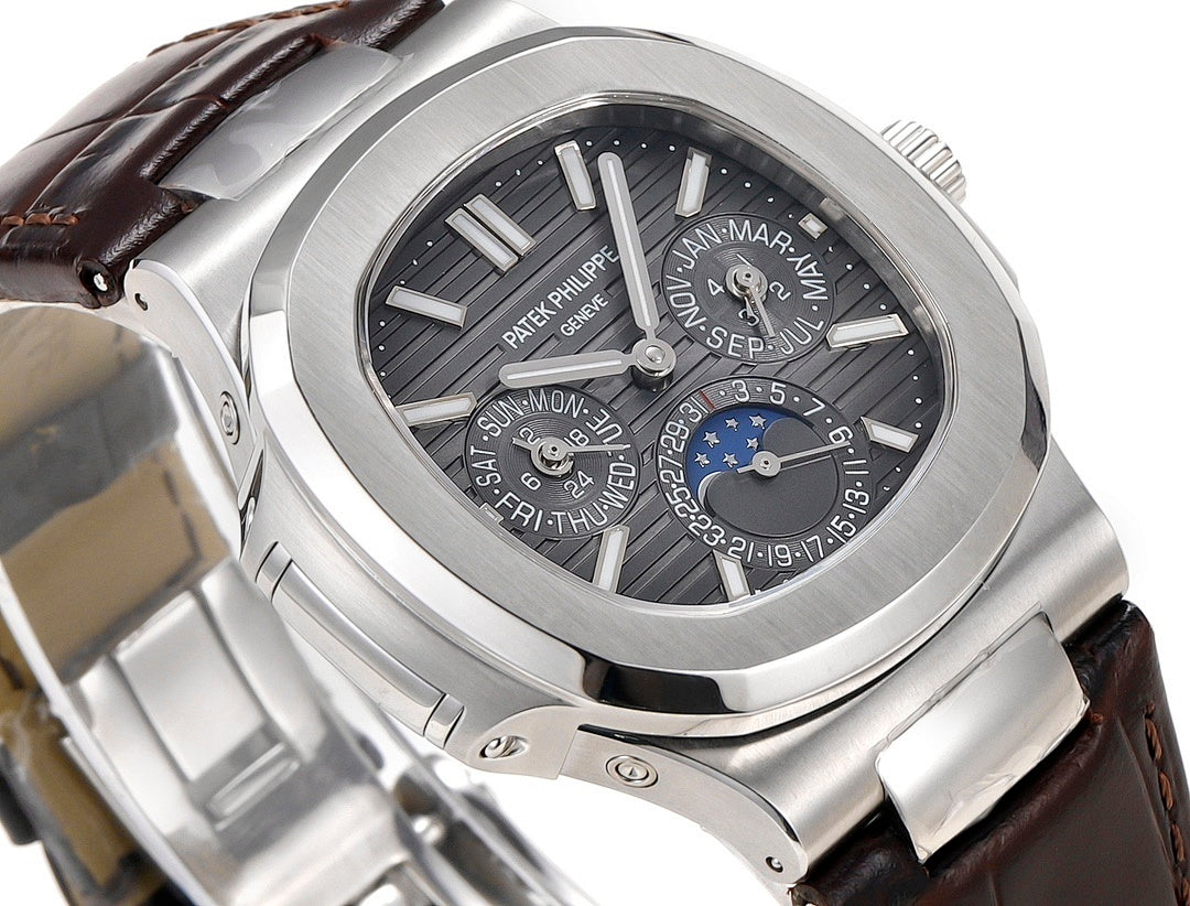 Patek Philippe Nautilus watch dial close-up with moonphase subdials and black face