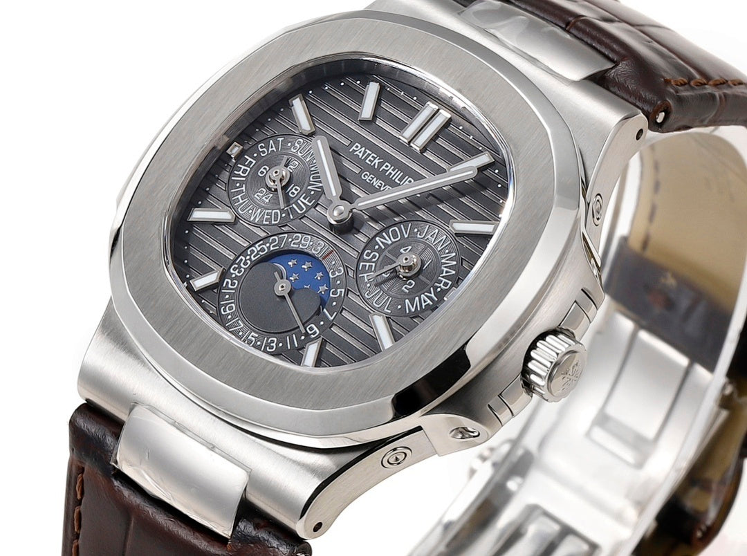 Patek Philippe Nautilus watch dial close-up with subdials and ring markers on black dial
