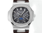 Patek Philippe Nautilus watch with black dial, silver markers, and brown leather strap