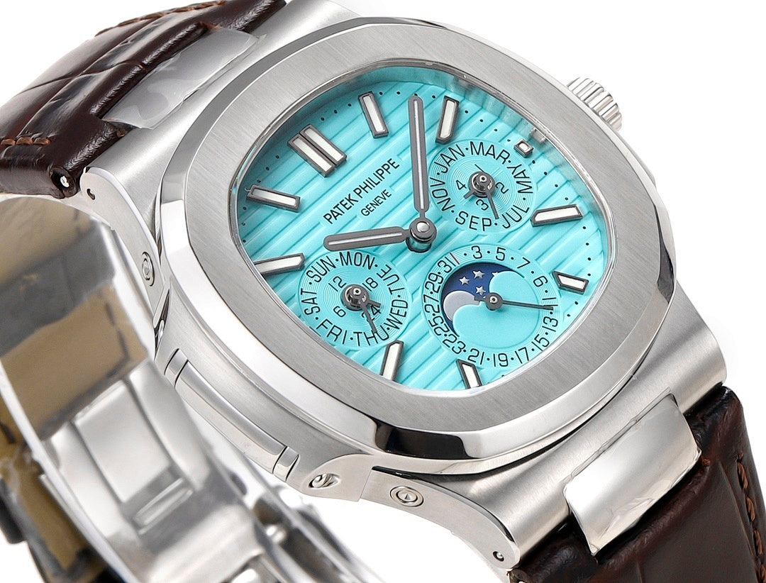 Patek Philippe watch close-up showing turquoise dial, crown, and brown leather strap