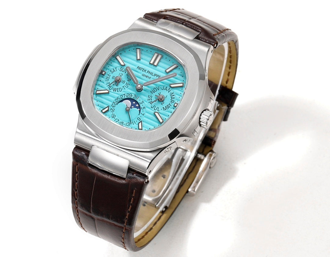 Patek Philippe watch 3/4 view with turquoise dial and brown leather strap on steel case