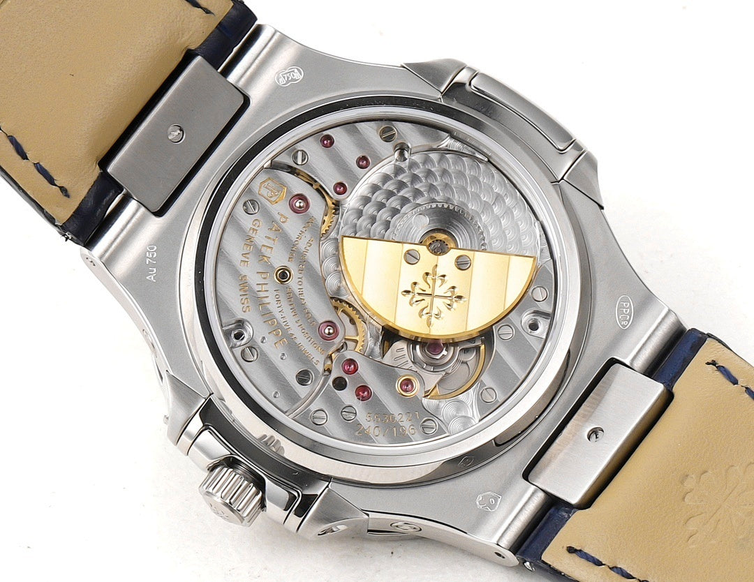 Automatic wristwatch caseback, exposed mechanical movement with gold-toned bridge