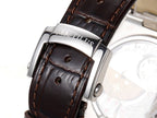 Patek Philippe watch leather strap and silver buckle clasp with hardware detail.